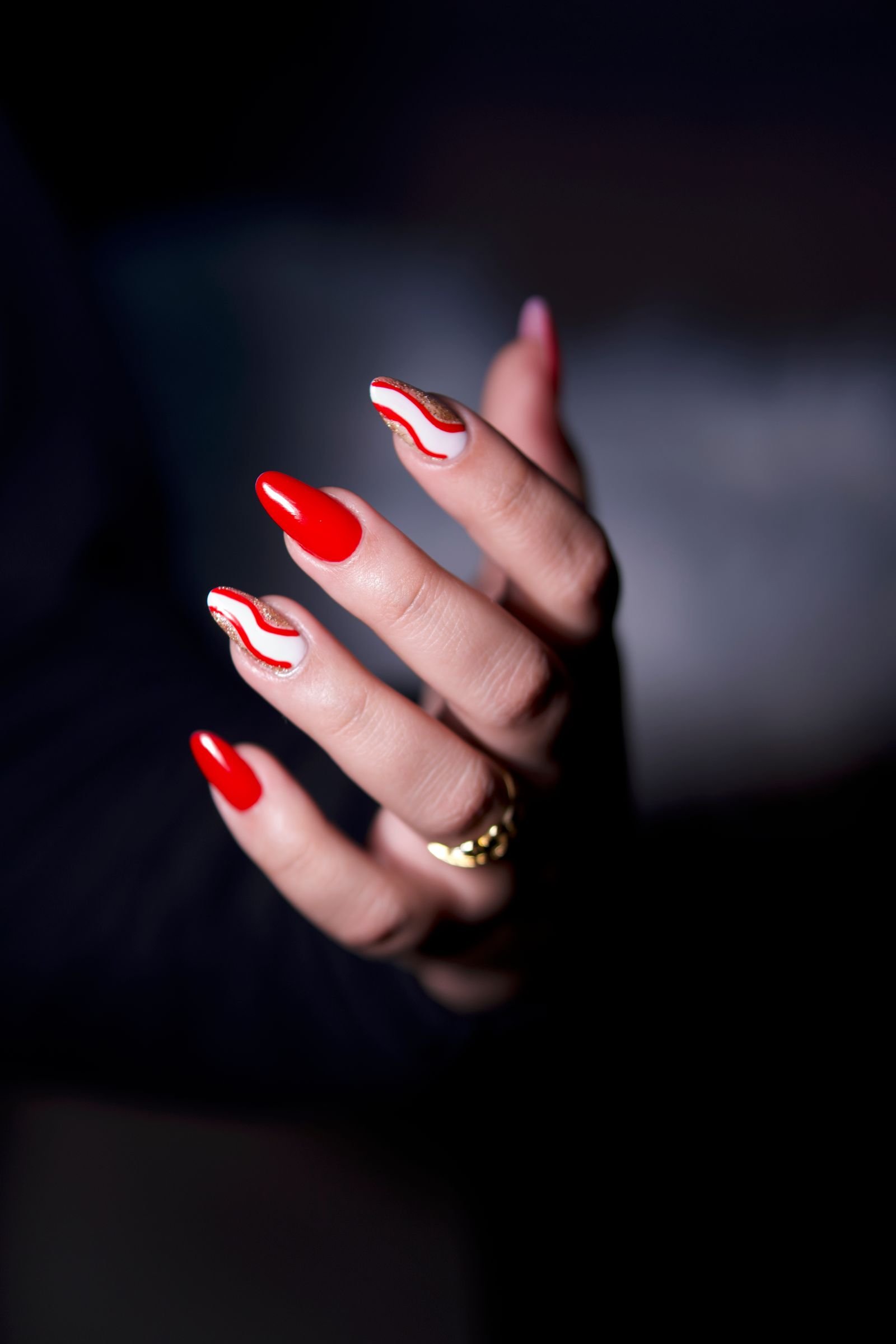 Hand-painted nail art on a fresh set at Rare Salon